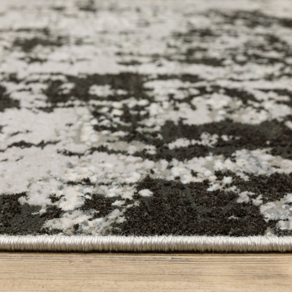 7" X 10" Gray and Ivory Abstract Power Loom Area Rug
