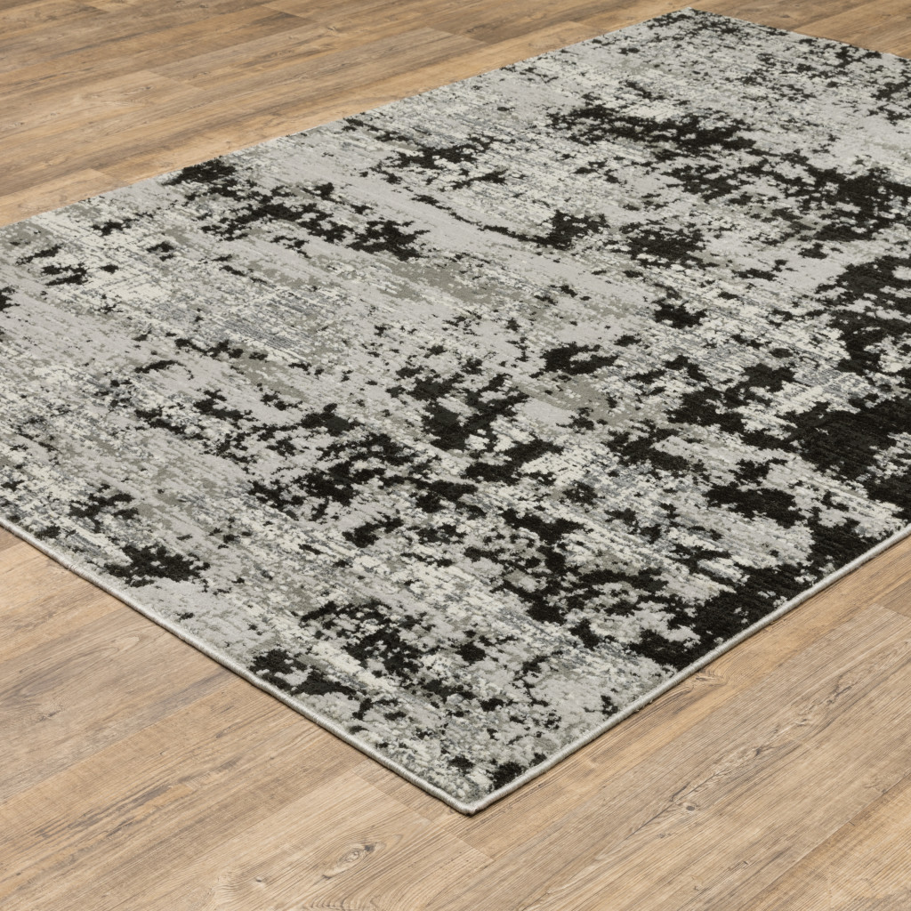 7" X 10" Gray and Ivory Abstract Power Loom Area Rug