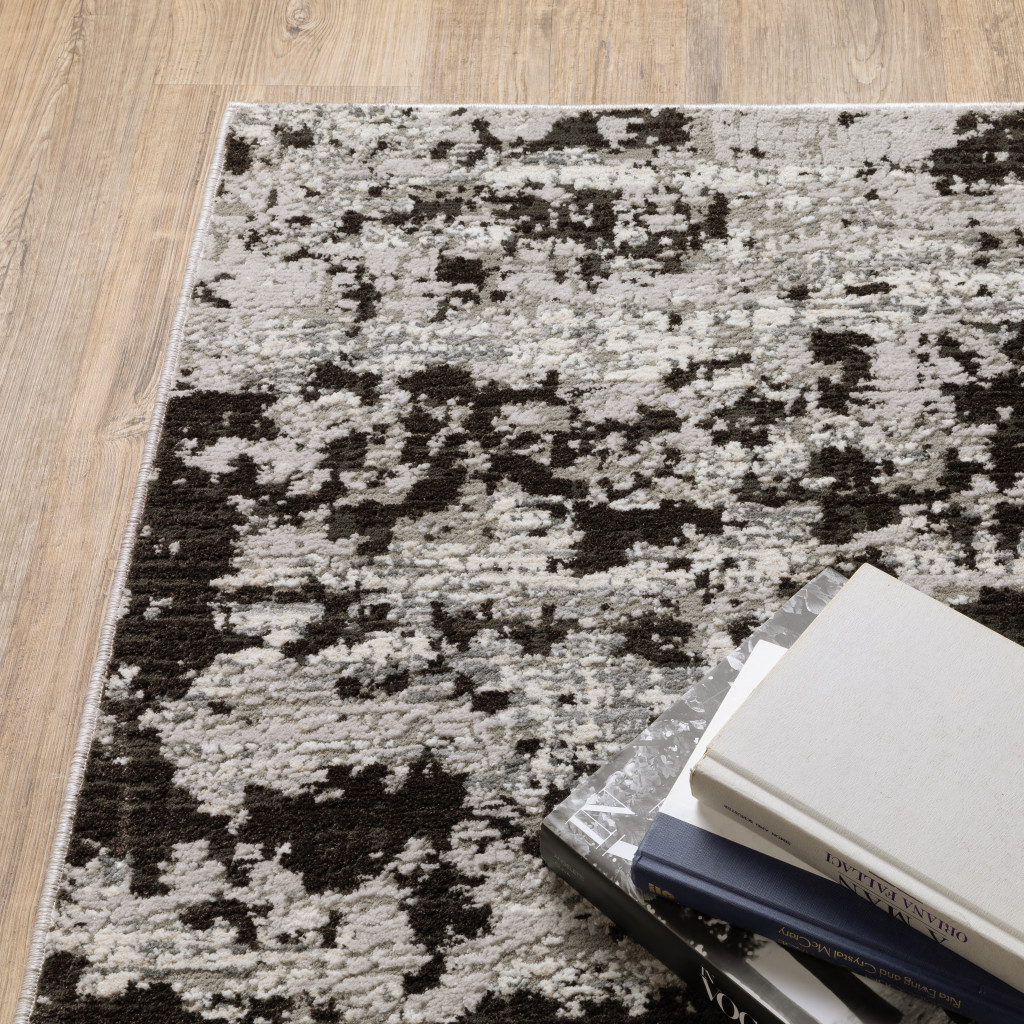 7" X 10" Gray and Ivory Abstract Power Loom Area Rug