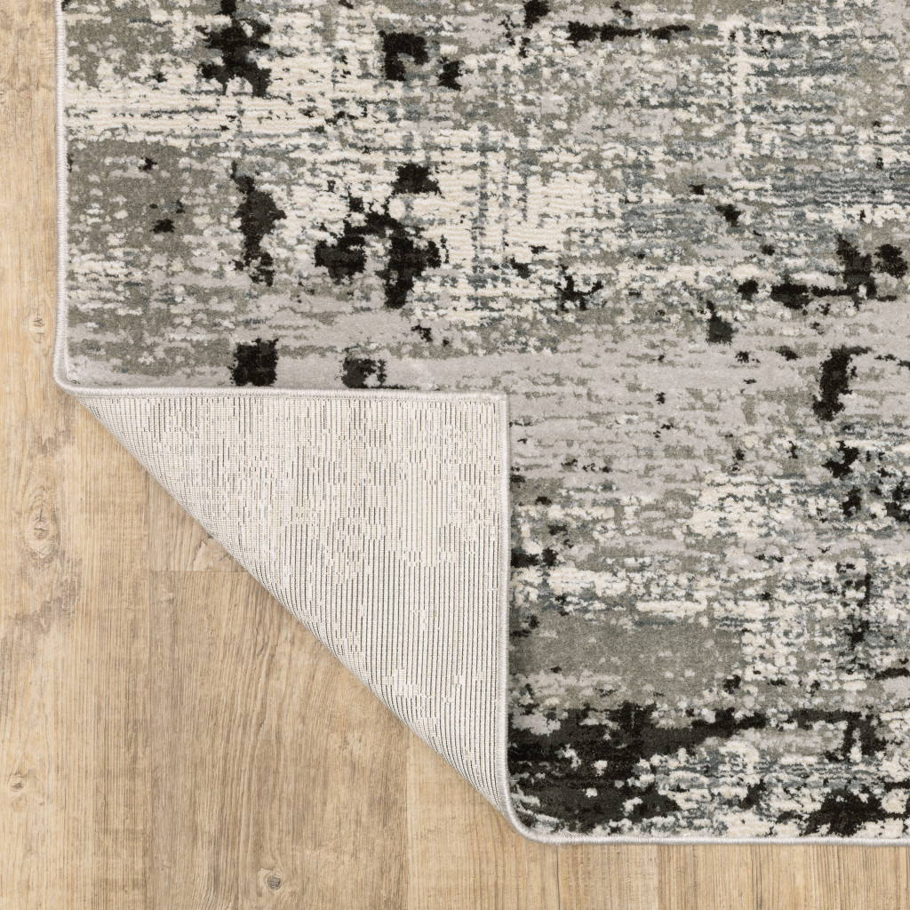 7" X 10" Gray and Ivory Abstract Power Loom Area Rug