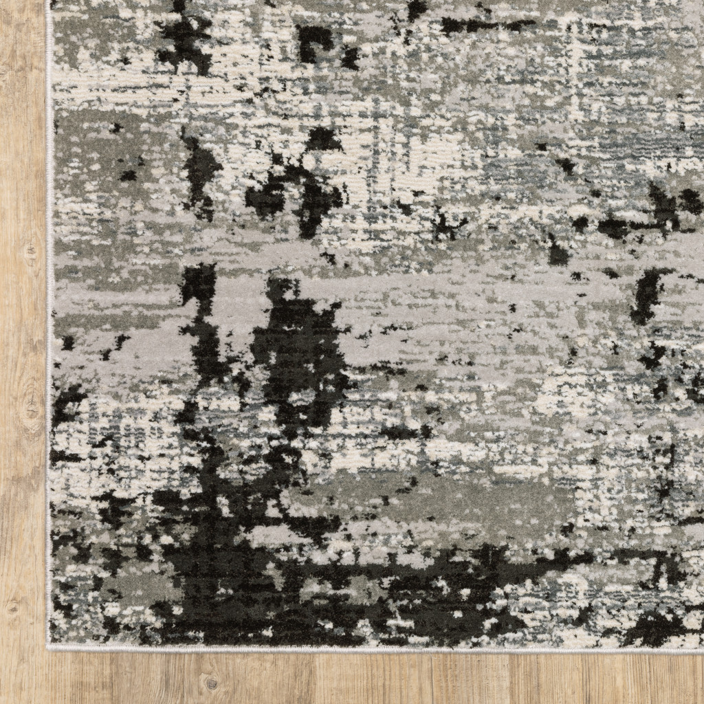 7" X 10" Gray and Ivory Abstract Power Loom Area Rug