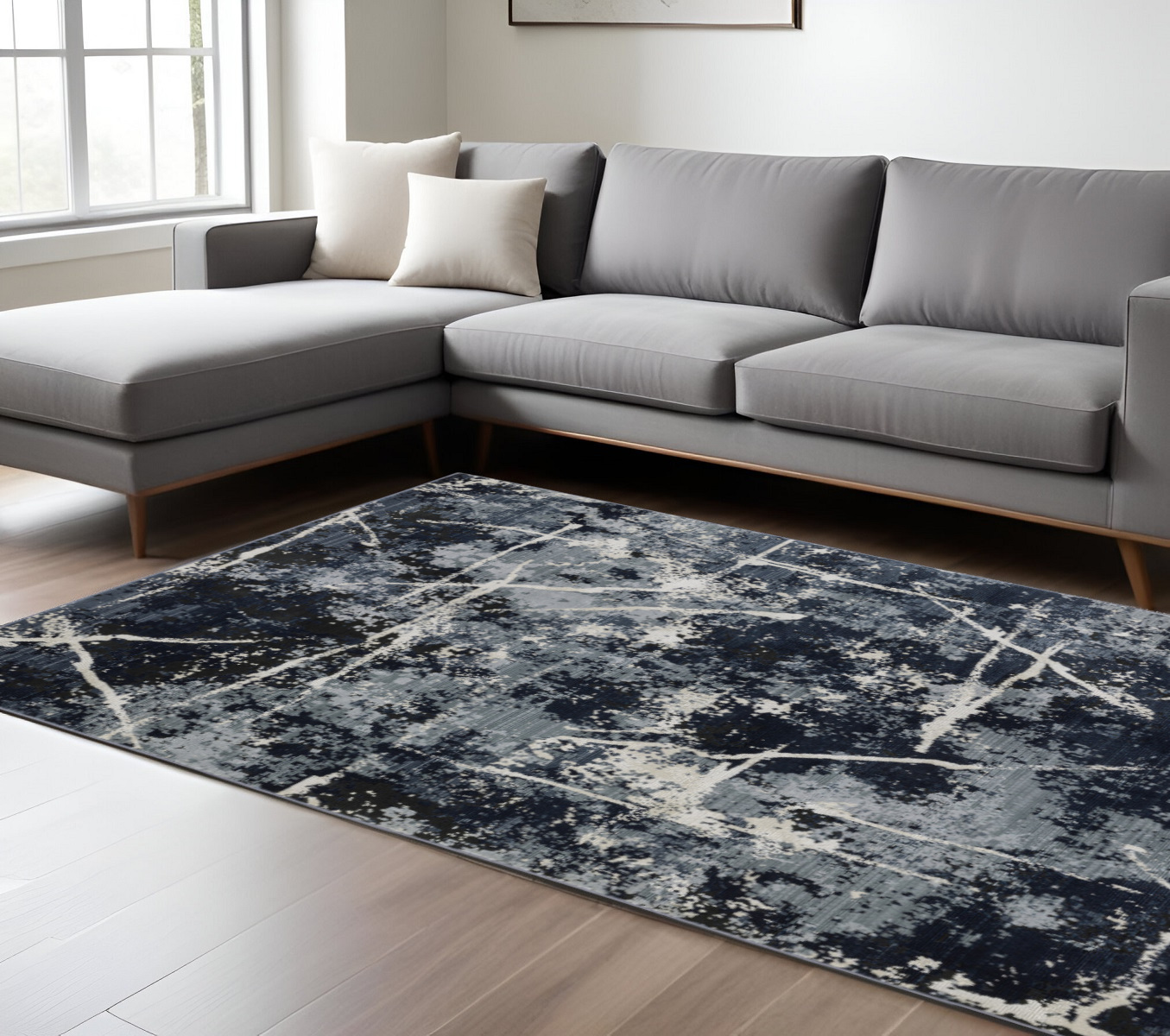 7" X 10" Black and Ivory Abstract Power Loom Area Rug