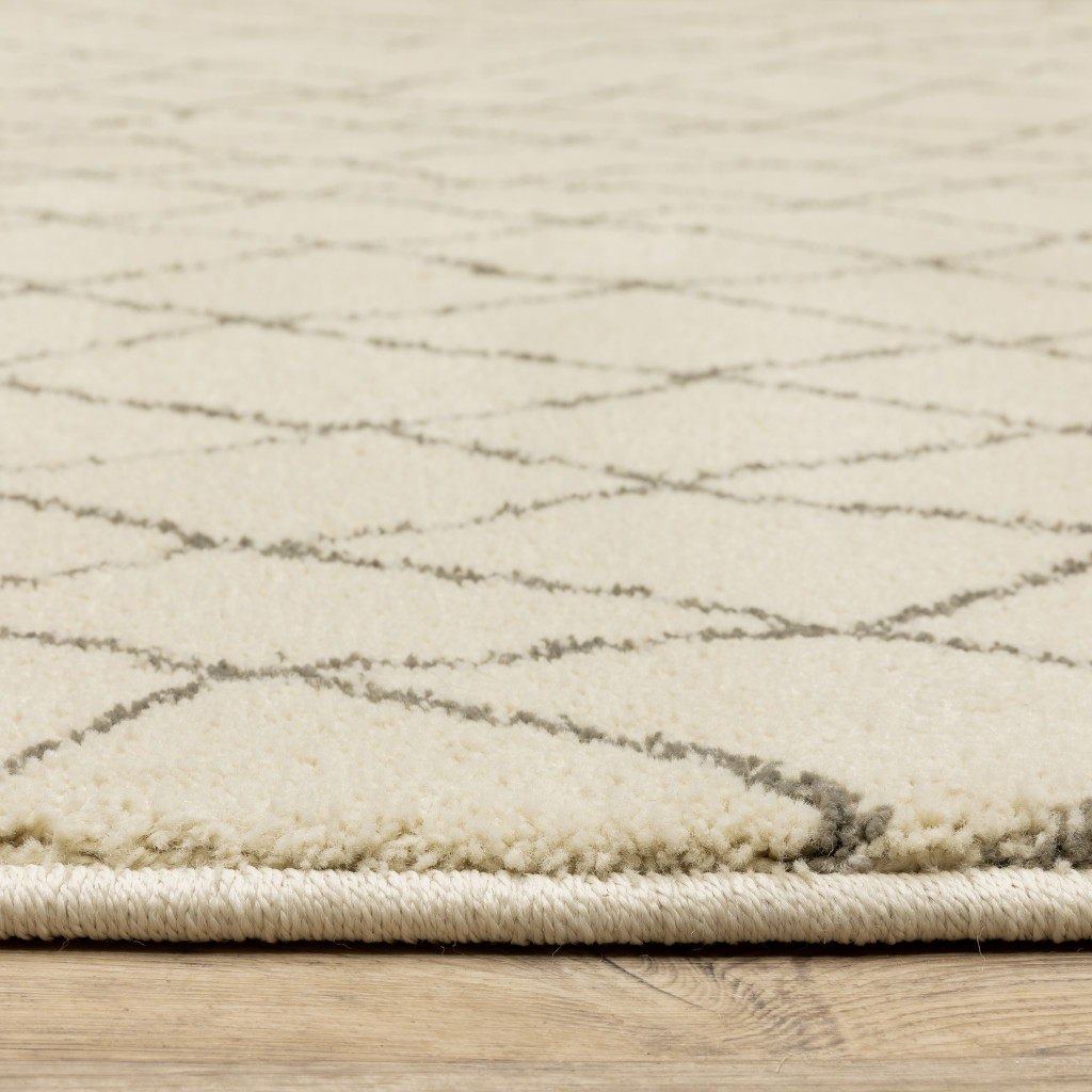 2" X 8" Ivory And Grey Geometric Power Loom Stain Resistant Runner Rug