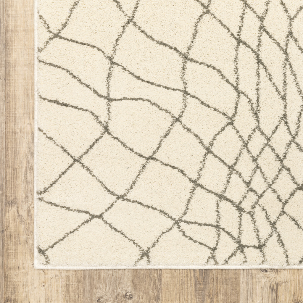 2" X 8" Ivory And Grey Geometric Power Loom Stain Resistant Runner Rug