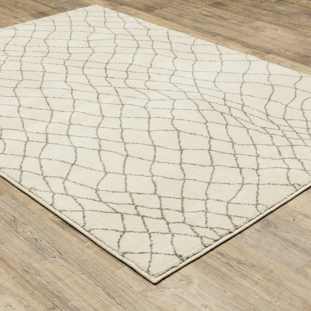 6" X 9" Ivory And Grey Geometric Power Loom Stain Resistant Area Rug