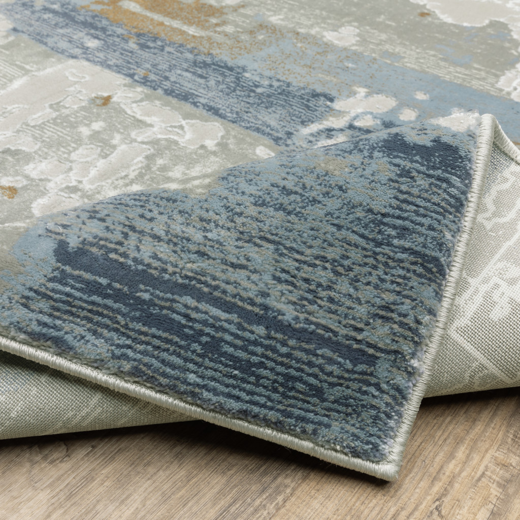 6" X 9" Grey Blue Navy Ivory And Brown Abstract Power Loom Stain Resistant Area Rug