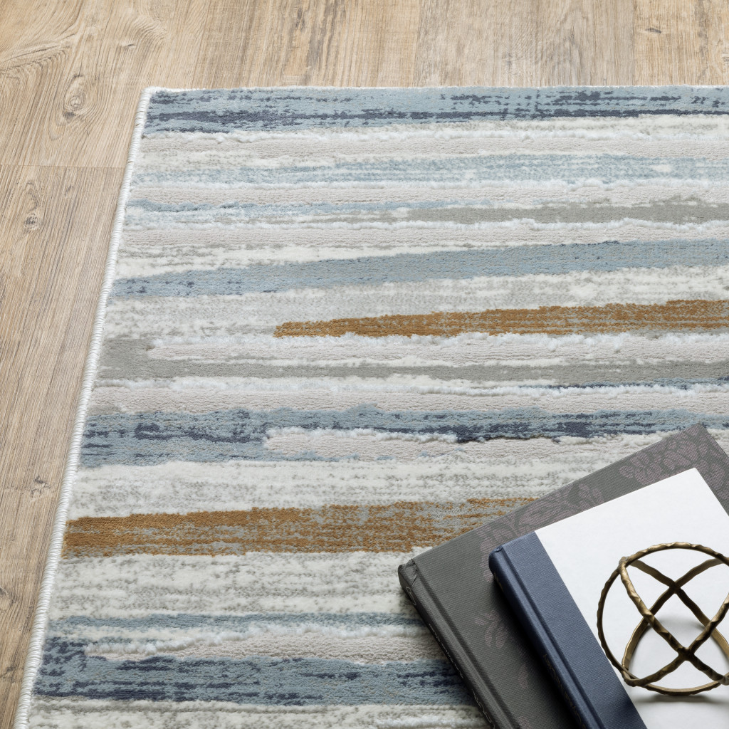 2" X 8" Grey Blue Ivory Brown Beige And Navy Abstract Power Loom Stain Resistant Runner Rug