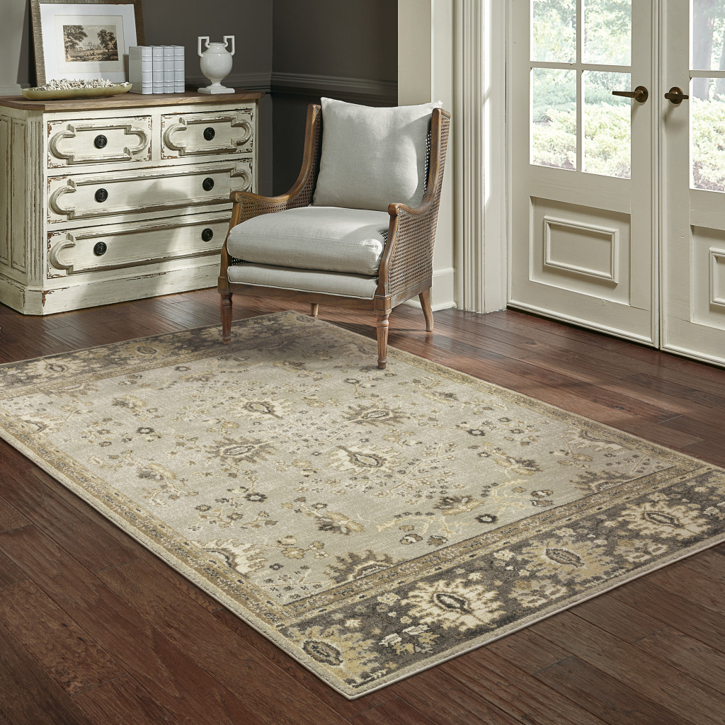 6" X 9" Grey Brown Tan And Beige Oriental Power Loom Stain Resistant Area Rug