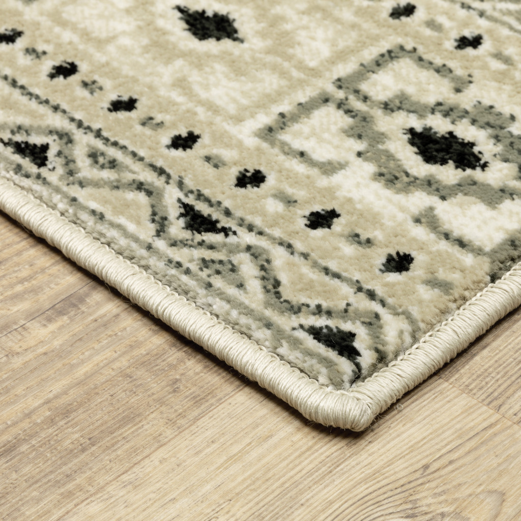 6" X 9" Ivory Grey Black And Ivory Southwestern Power Loom Stain Resistant Area Rug