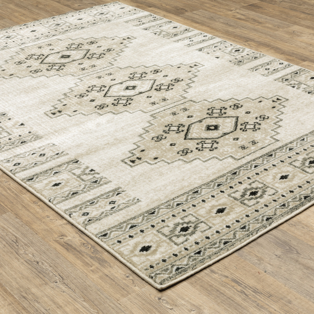 6" X 9" Ivory Grey Black And Ivory Southwestern Power Loom Stain Resistant Area Rug
