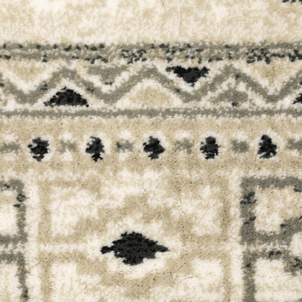 6" X 9" Ivory Grey Black And Ivory Southwestern Power Loom Stain Resistant Area Rug