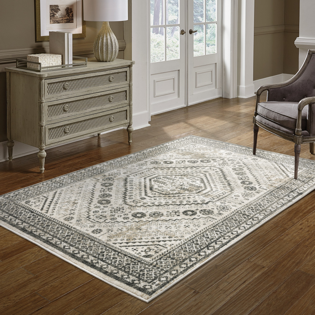 5" X 7" Ivory Grey Black And Ivory Oriental Power Loom Stain Resistant Area Rug