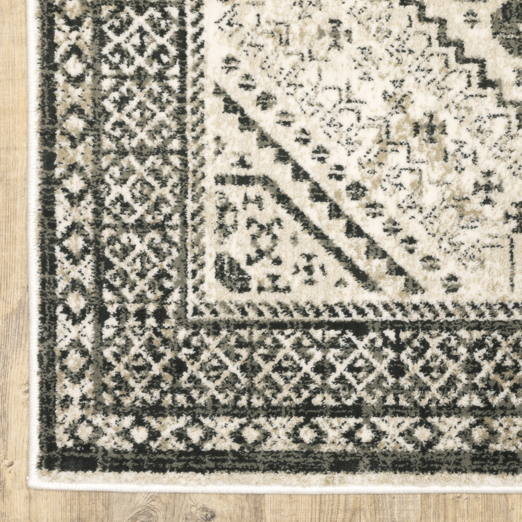 5" X 7" Ivory Grey Black And Ivory Oriental Power Loom Stain Resistant Area Rug
