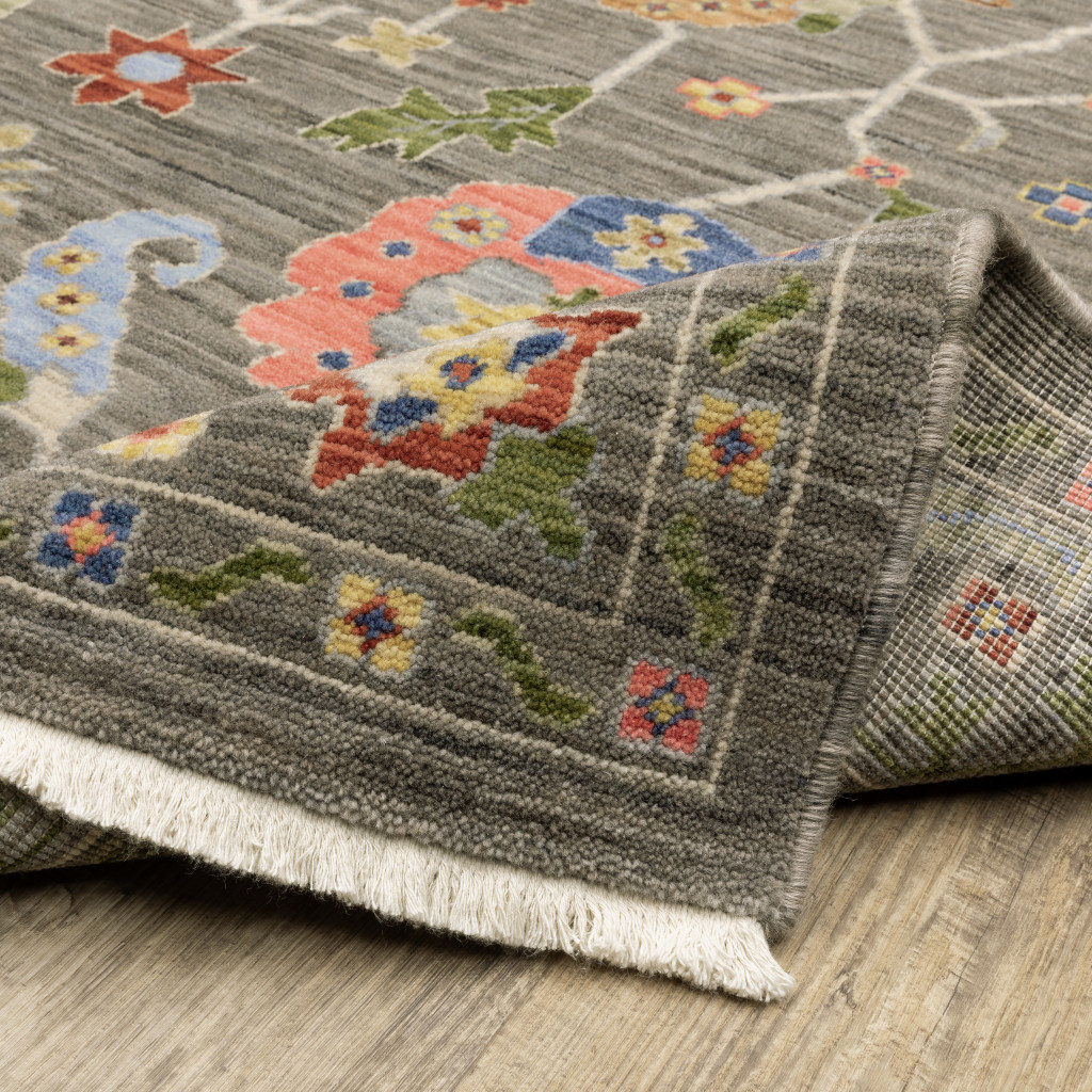 6" X 9" Grey Blue Pink Orange Rust Red Green And Ivory Oriental Power Loom Stain Resistant Area Rug With Fringe