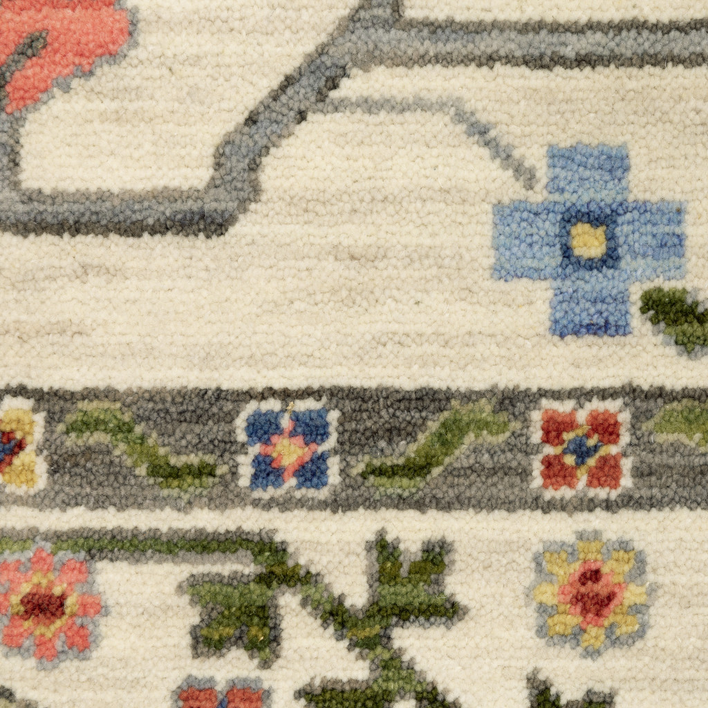 2" X 3" Ivory Green Blues Pink Yellow Rust Brown Tan And Grey Oriental Power Loom Stain Resistant Area Rug With Fringe