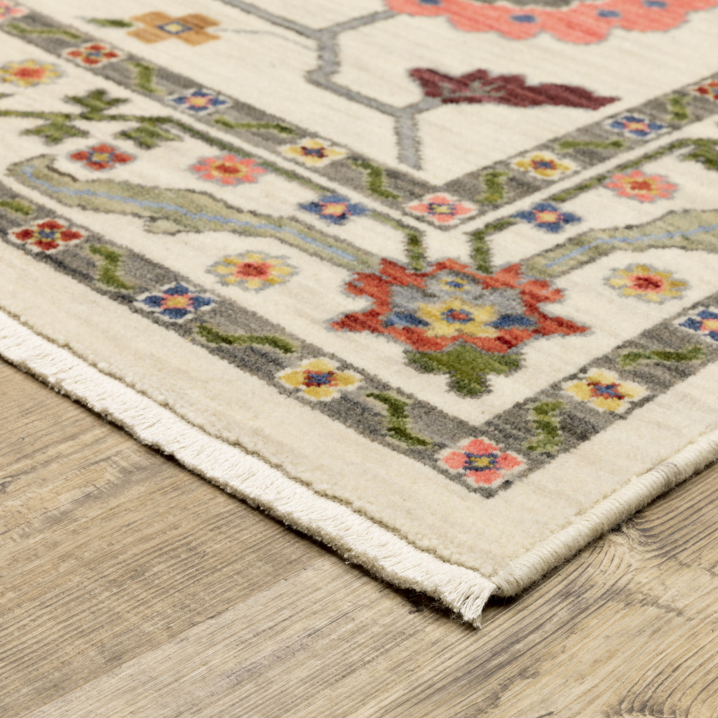 6" X 9" Ivory Green Blues Pink Yellow Rust Brown Tan And Grey Oriental Power Loom Stain Resistant Area Rug With Fringe