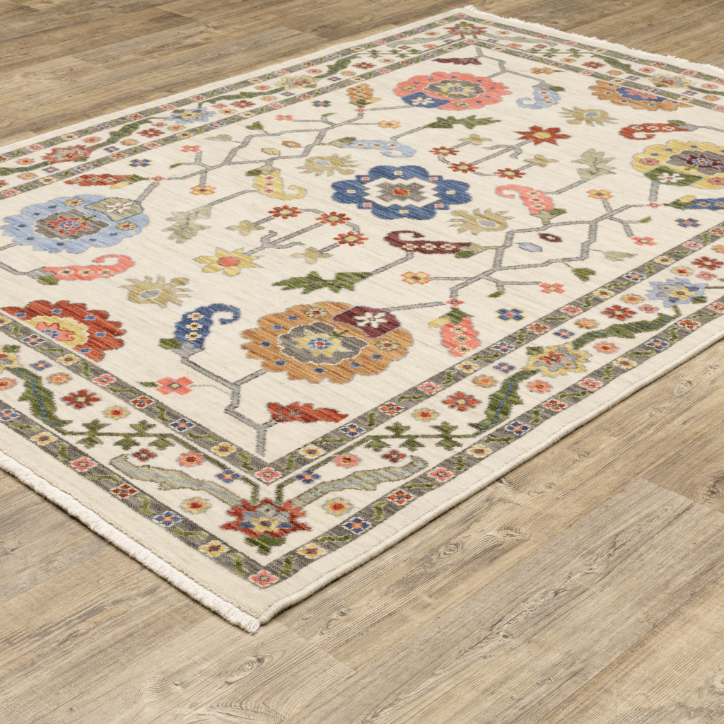 6" X 9" Ivory Green Blues Pink Yellow Rust Brown Tan And Grey Oriental Power Loom Stain Resistant Area Rug With Fringe