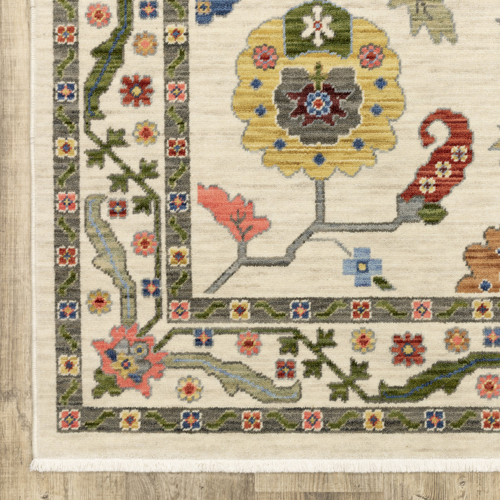 6" X 9" Ivory Green Blues Pink Yellow Rust Brown Tan And Grey Oriental Power Loom Stain Resistant Area Rug With Fringe