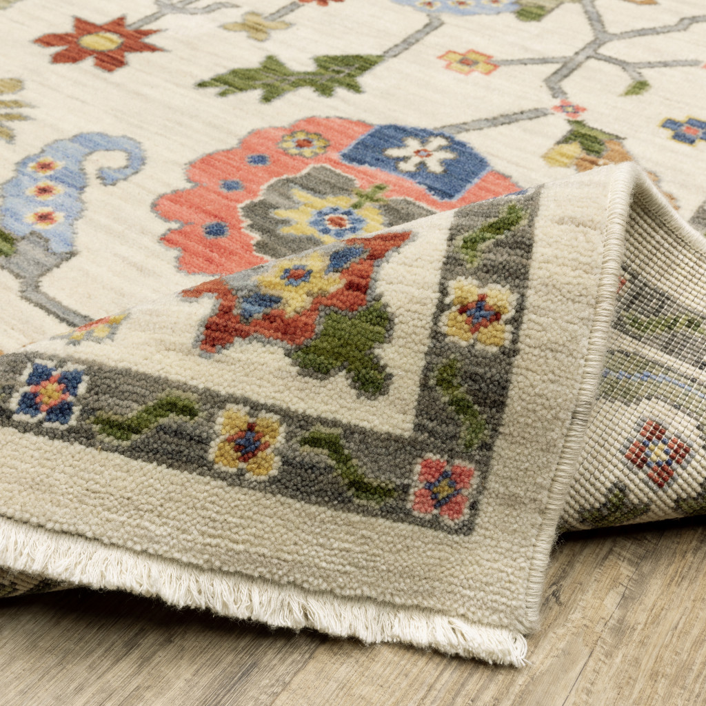 6" X 9" Ivory Green Blues Pink Yellow Rust Brown Tan And Grey Oriental Power Loom Stain Resistant Area Rug With Fringe