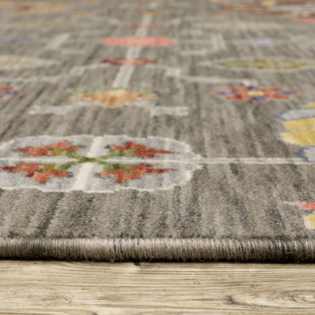 2" X 3" Grey Charcoal Yellow Blue Rust Red Pink Green And Ivory Oriental Power Loom Stain Resistant Area Rug With Fringe