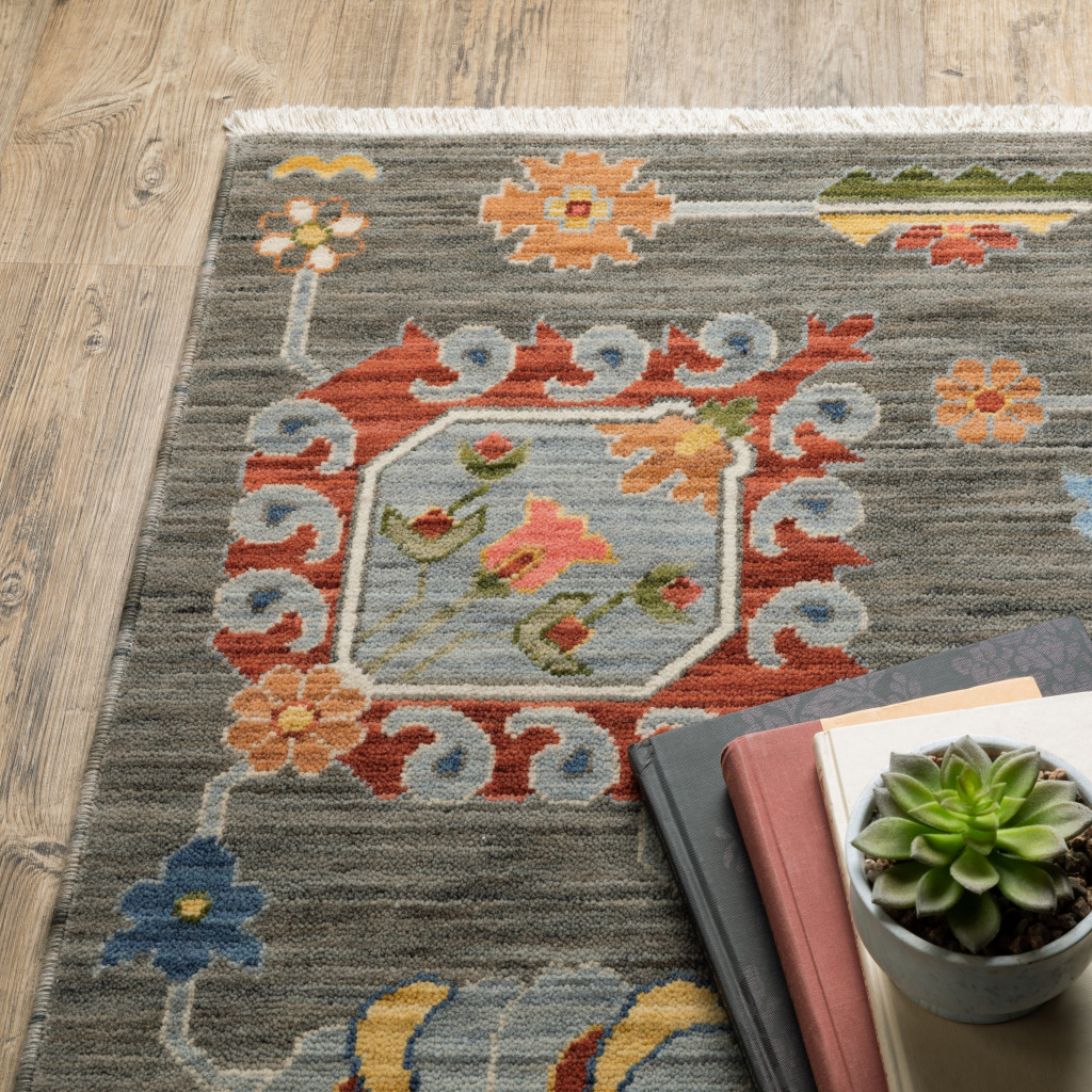 2" X 3" Grey Charcoal Yellow Blue Rust Red Pink Green And Ivory Oriental Power Loom Stain Resistant Area Rug With Fringe