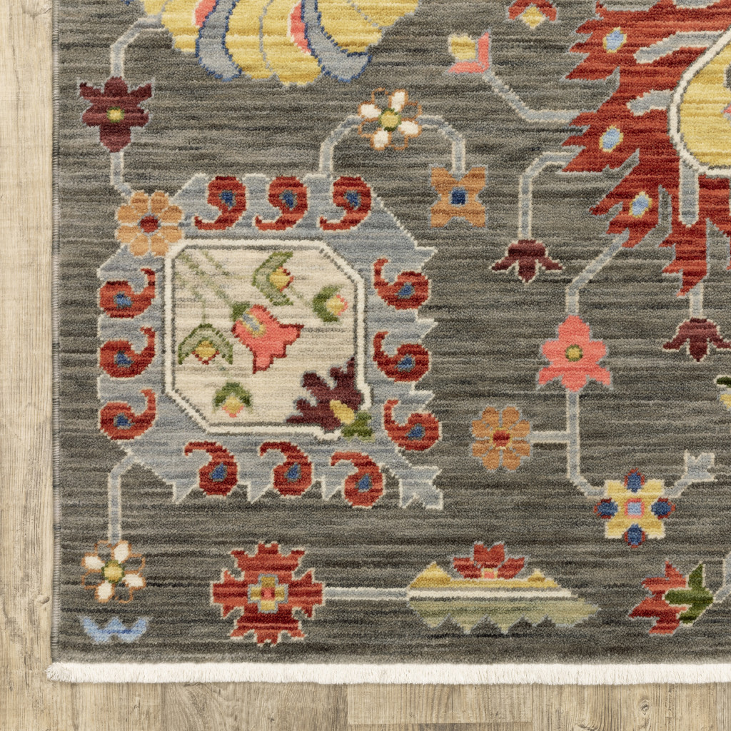 2" X 3" Grey Charcoal Yellow Blue Rust Red Pink Green And Ivory Oriental Power Loom Stain Resistant Area Rug With Fringe
