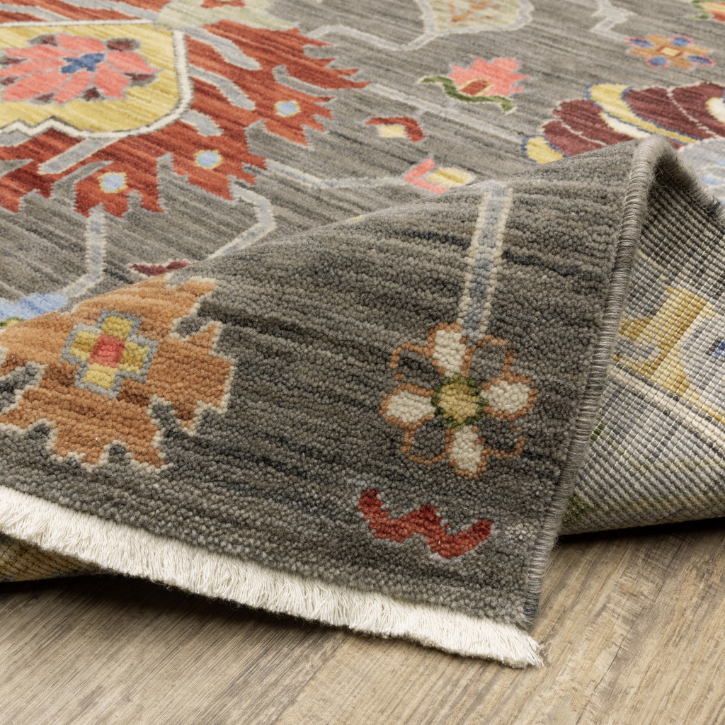2" X 3" Grey Charcoal Yellow Blue Rust Red Pink Green And Ivory Oriental Power Loom Stain Resistant Area Rug With Fringe