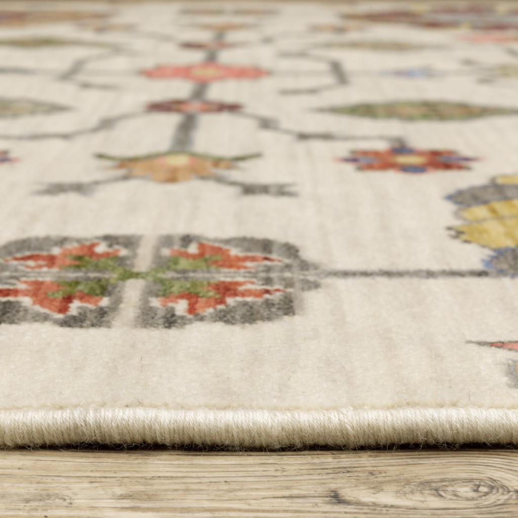 3" X 5" Ivory Yellow Rust Green Grey Pink Orange Blue And Grey Oriental Power Loom Stain Resistant Area Rug With Fringe