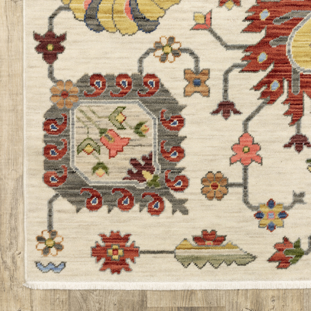 3" X 5" Ivory Yellow Rust Green Grey Pink Orange Blue And Grey Oriental Power Loom Stain Resistant Area Rug With Fringe
