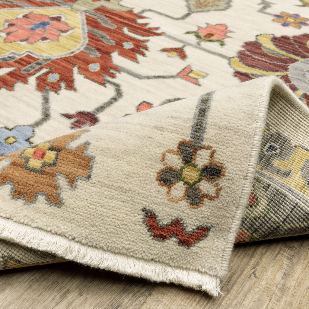 3" X 5" Ivory Yellow Rust Green Grey Pink Orange Blue And Grey Oriental Power Loom Stain Resistant Area Rug With Fringe