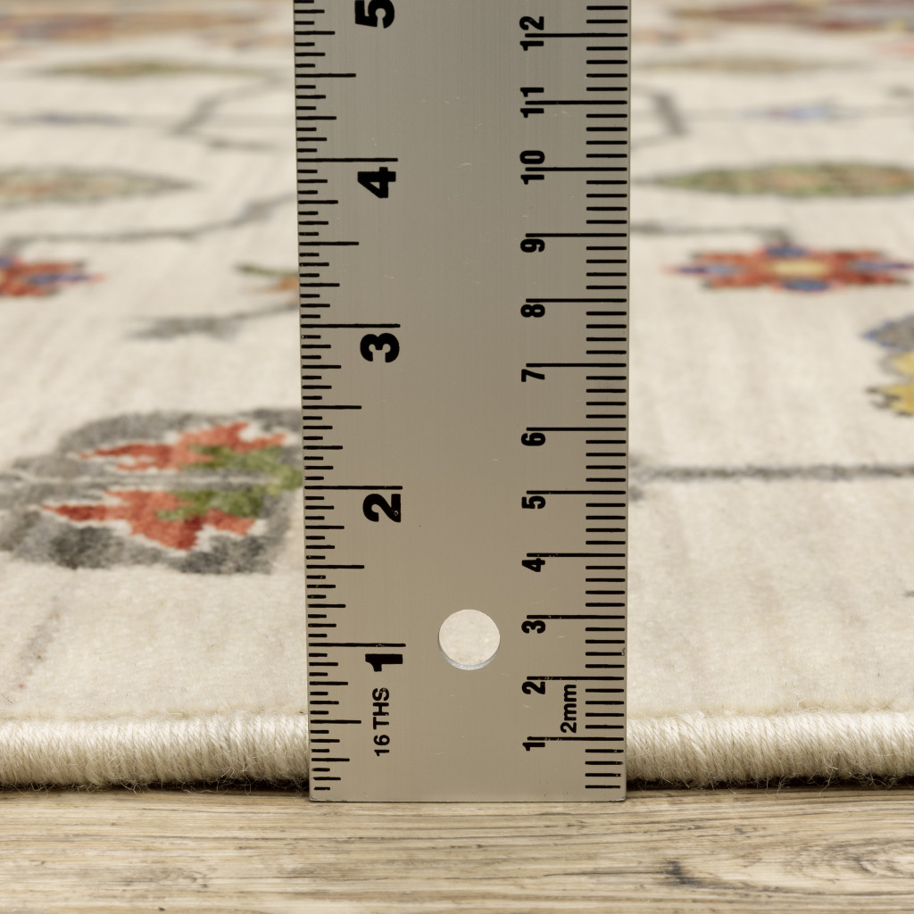 3" X 5" Ivory Yellow Rust Green Grey Pink Orange Blue And Grey Oriental Power Loom Stain Resistant Area Rug With Fringe