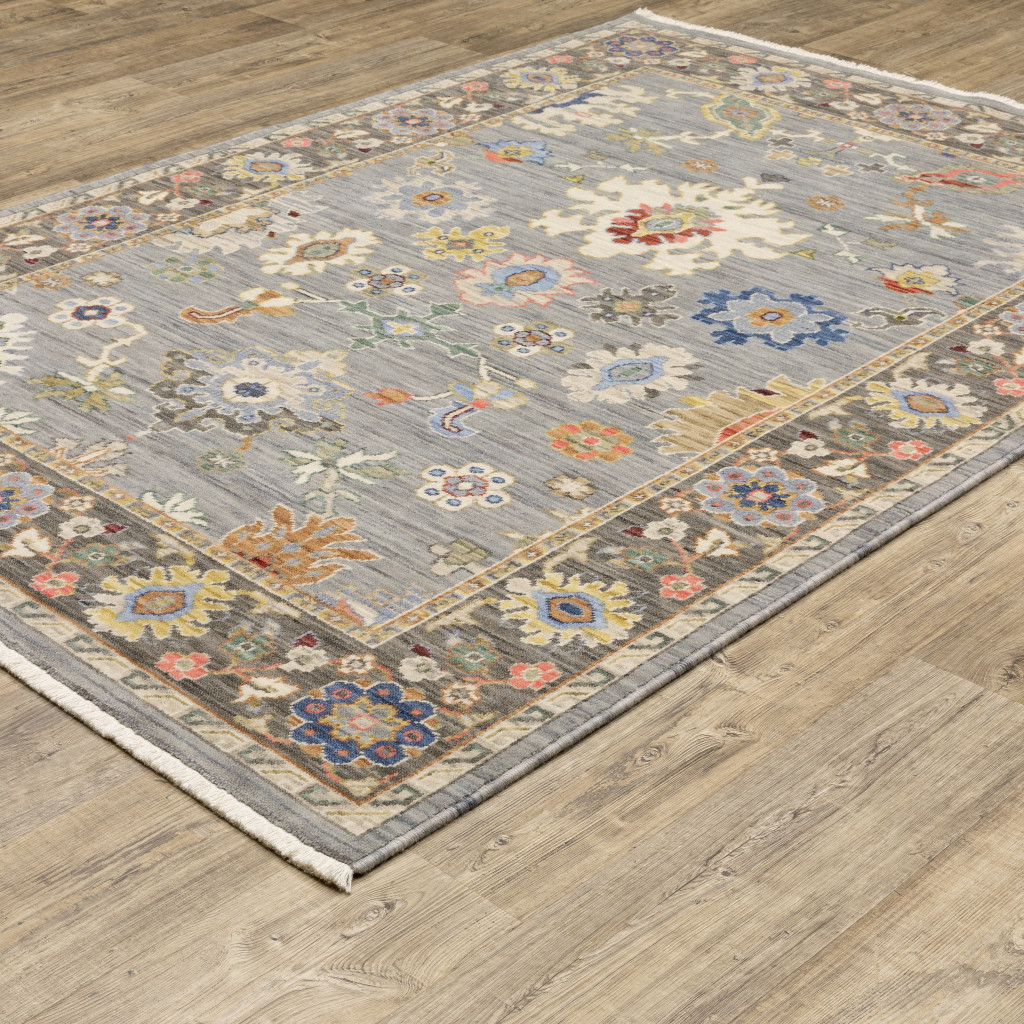 5" X 8" Blue and Ivory Oriental Power Loom Area Rug With Fringe