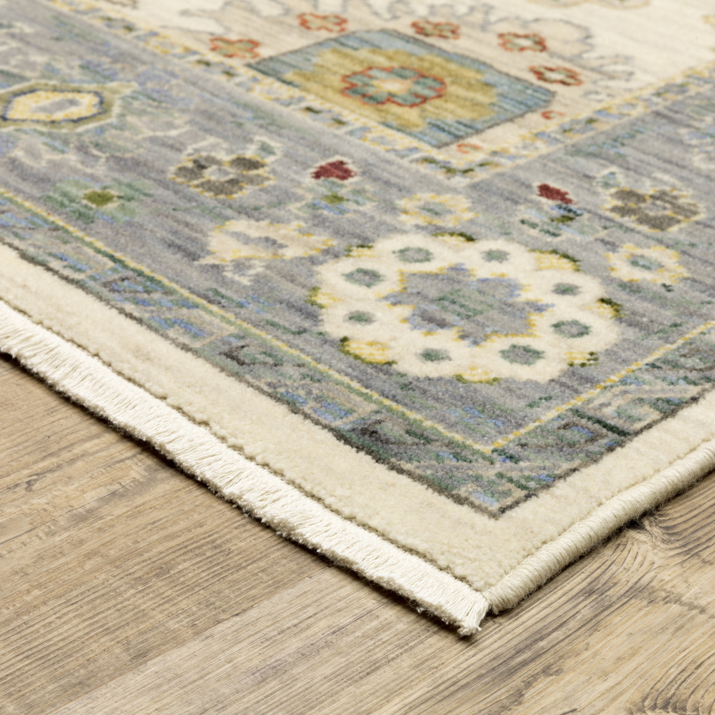 2" X 6" Ivory Blue Grey Teal Gold Green And Rust Oriental Power Loom Stain Resistant Runner Rug With Fringe