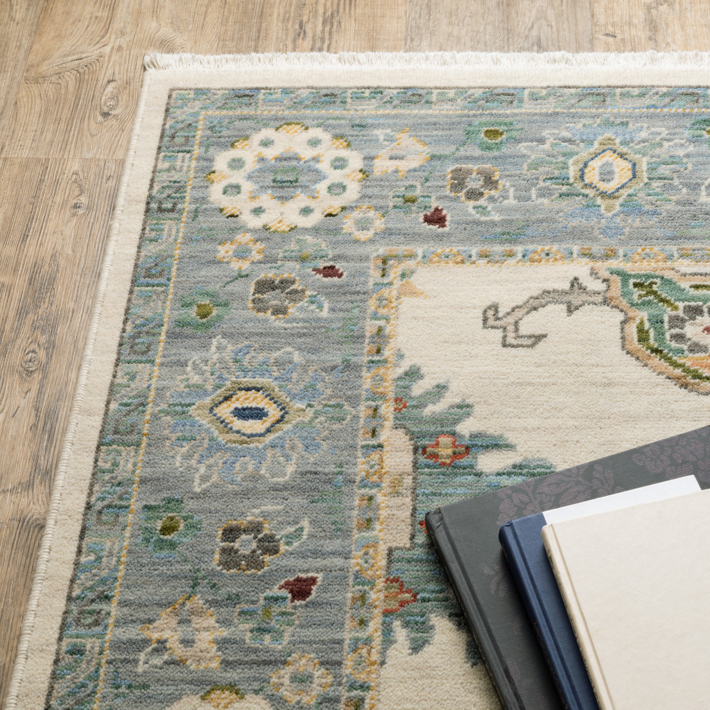 2" X 6" Ivory Blue Grey Teal Gold Green And Rust Oriental Power Loom Stain Resistant Runner Rug With Fringe