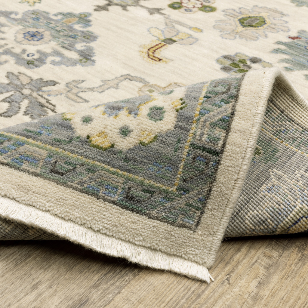 2" X 6" Ivory Blue Grey Teal Gold Green And Rust Oriental Power Loom Stain Resistant Runner Rug With Fringe