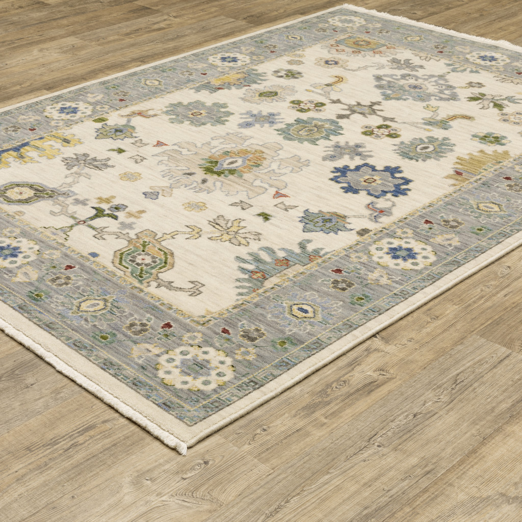 10" X 13" Ivory Blue Grey Teal Gold Green And Rust Oriental Power Loom Stain Resistant Area Rug With Fringe