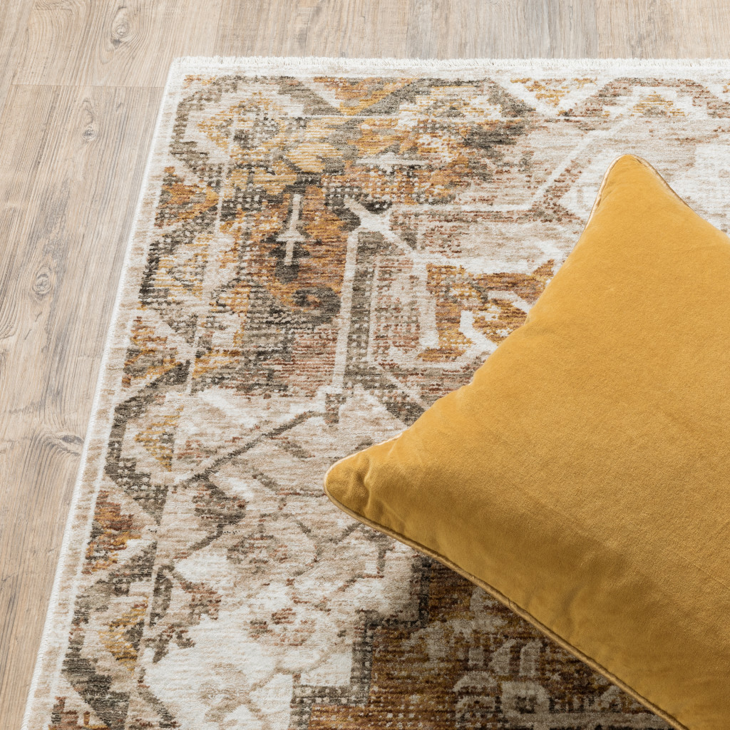 2" X 8" Gold And Ivory Oriental Power Loom Stain Resistant Runner Rug With Fringe
