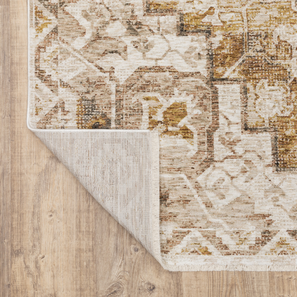 2" X 8" Gold And Ivory Oriental Power Loom Stain Resistant Runner Rug With Fringe