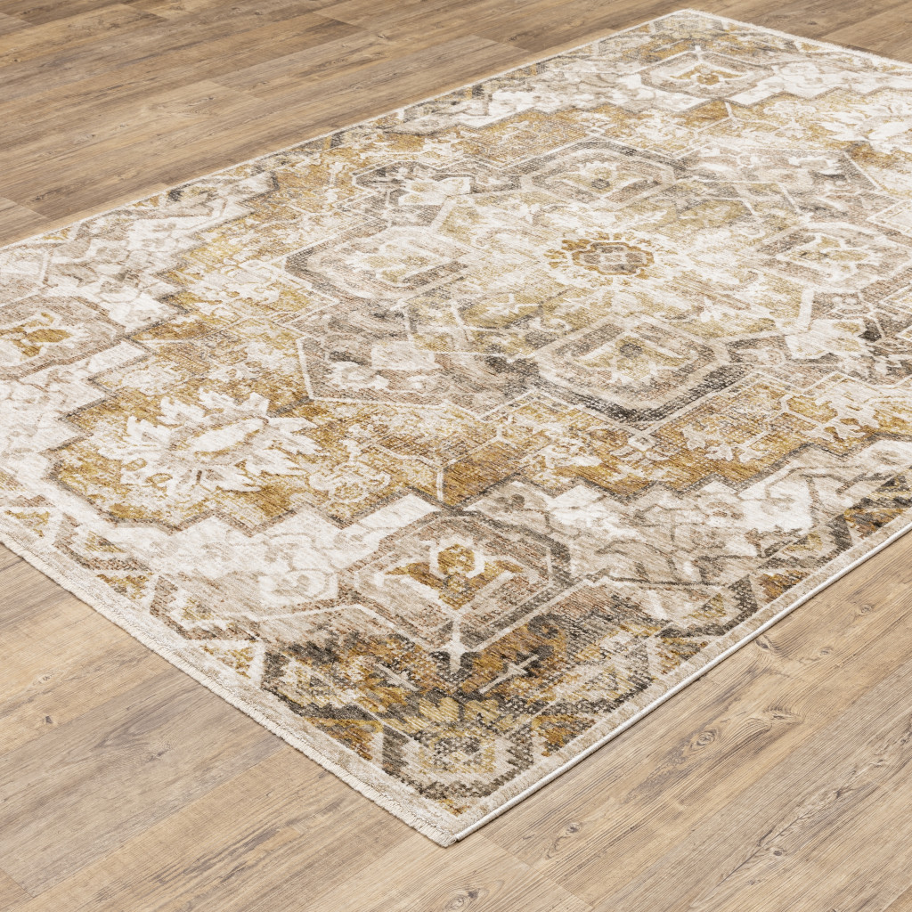 6" X 9" Gold And Ivory Oriental Power Loom Stain Resistant Area Rug With Fringe