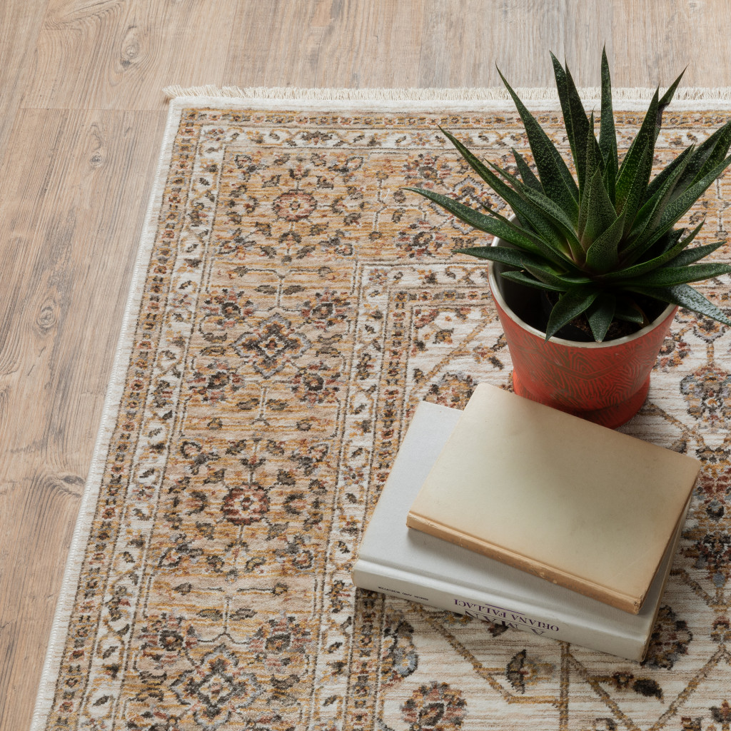 2" X 3" Ivory And Gold Oriental Power Loom Stain Resistant Area Rug With Fringe