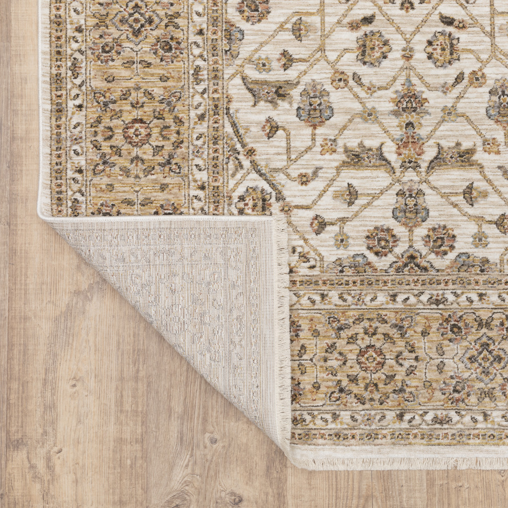7" X 10" Gold and Ivory Oriental Power Loom Area Rug With Fringe