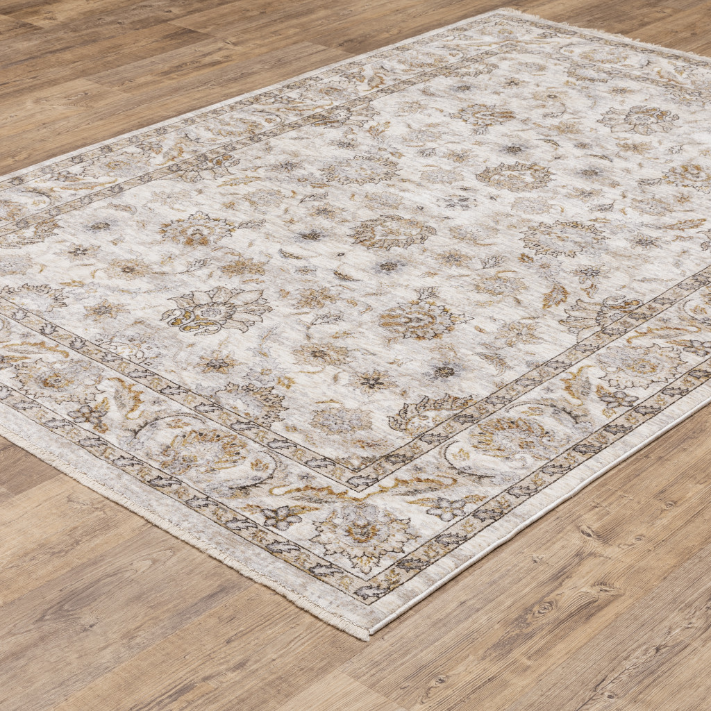 5" X 8" Ivory And Grey Oriental Power Loom Stain Resistant Area Rug With Fringe