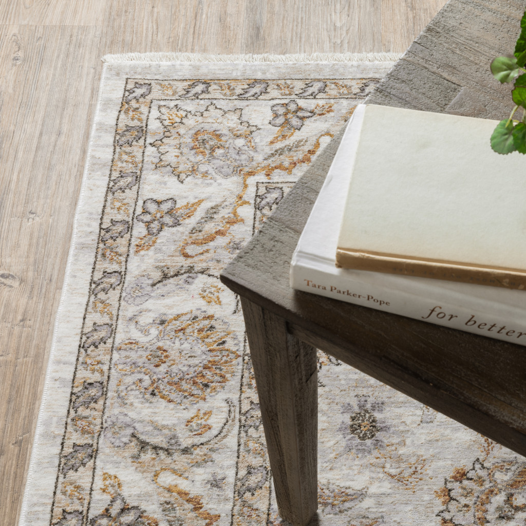 5" X 8" Ivory And Grey Oriental Power Loom Stain Resistant Area Rug With Fringe