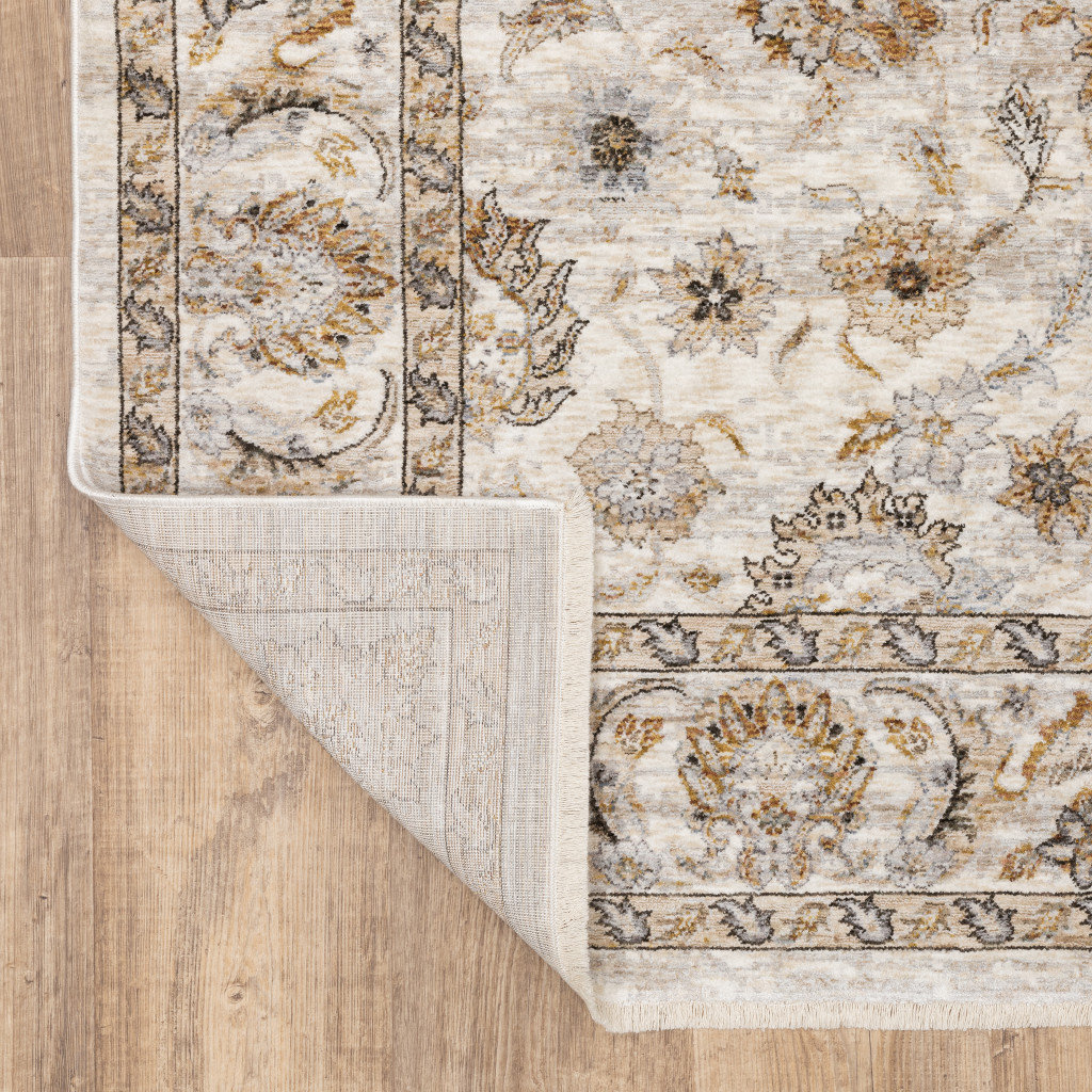 5" X 8" Ivory And Grey Oriental Power Loom Stain Resistant Area Rug With Fringe