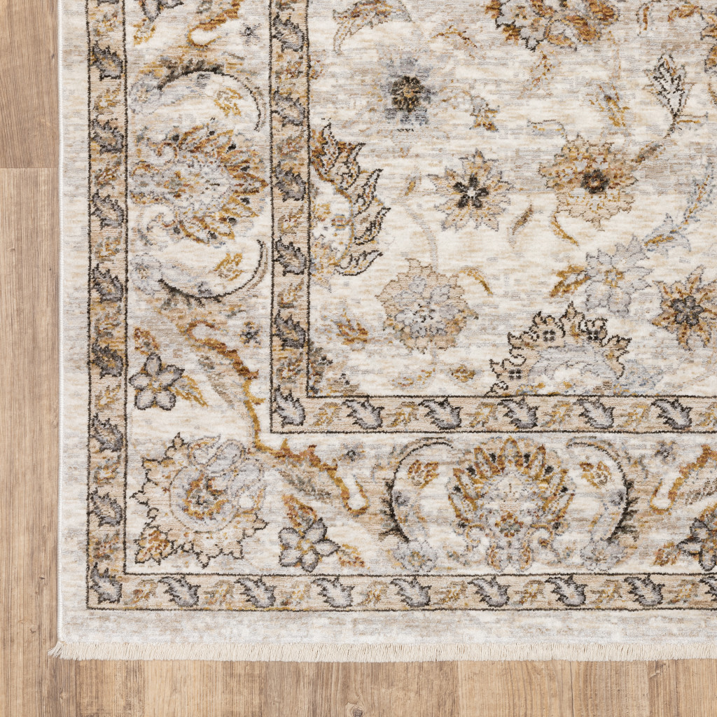 5" X 8" Ivory And Grey Oriental Power Loom Stain Resistant Area Rug With Fringe