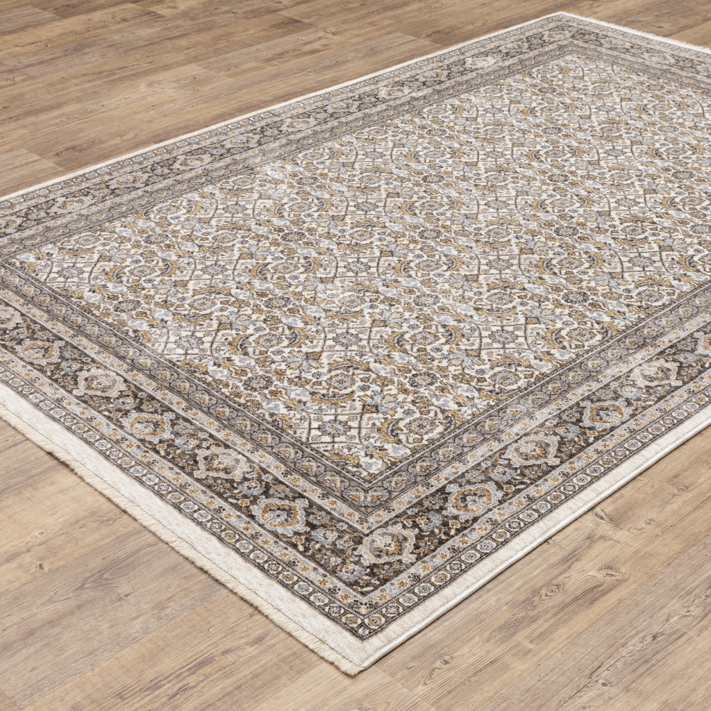 3" X 5" Ivory And Grey Oriental Power Loom Stain Resistant Area Rug With Fringe