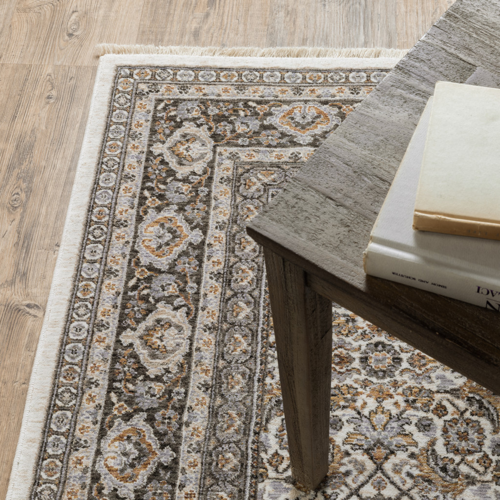 3" X 5" Ivory And Grey Oriental Power Loom Stain Resistant Area Rug With Fringe
