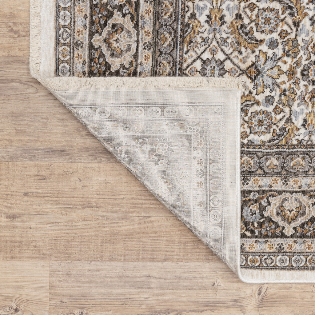 5" X 8" Ivory And Grey Oriental Power Loom Stain Resistant Area Rug With Fringe