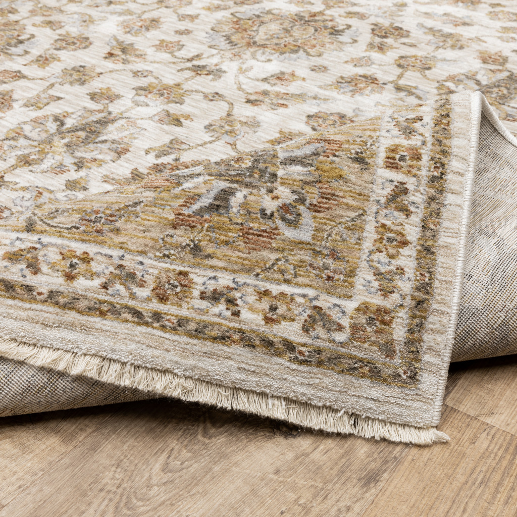 2" X 3" Ivory And Gold Oriental Power Loom Stain Resistant Area Rug With Fringe