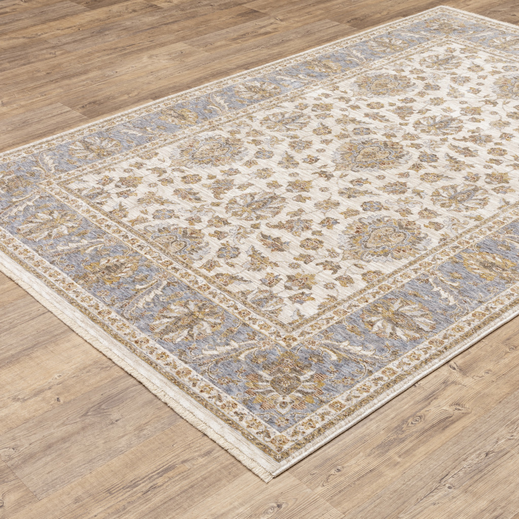 3" X 5" Ivory And Blue Oriental Power Loom Stain Resistant Area Rug With Fringe